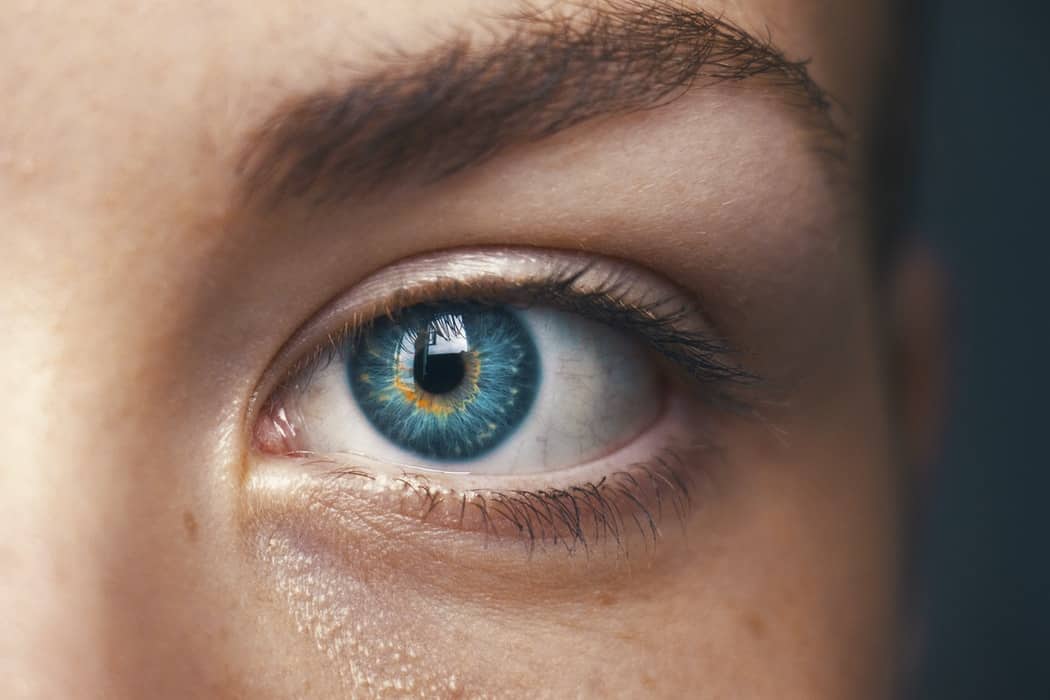 Human eye, blue with pronounced golden yellow streaks.