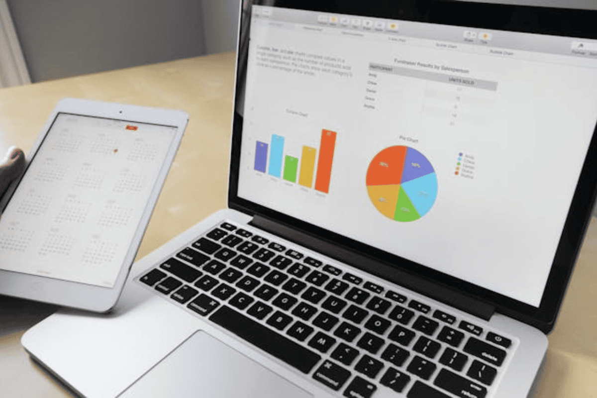 A laptop with graphs and statistics on its display